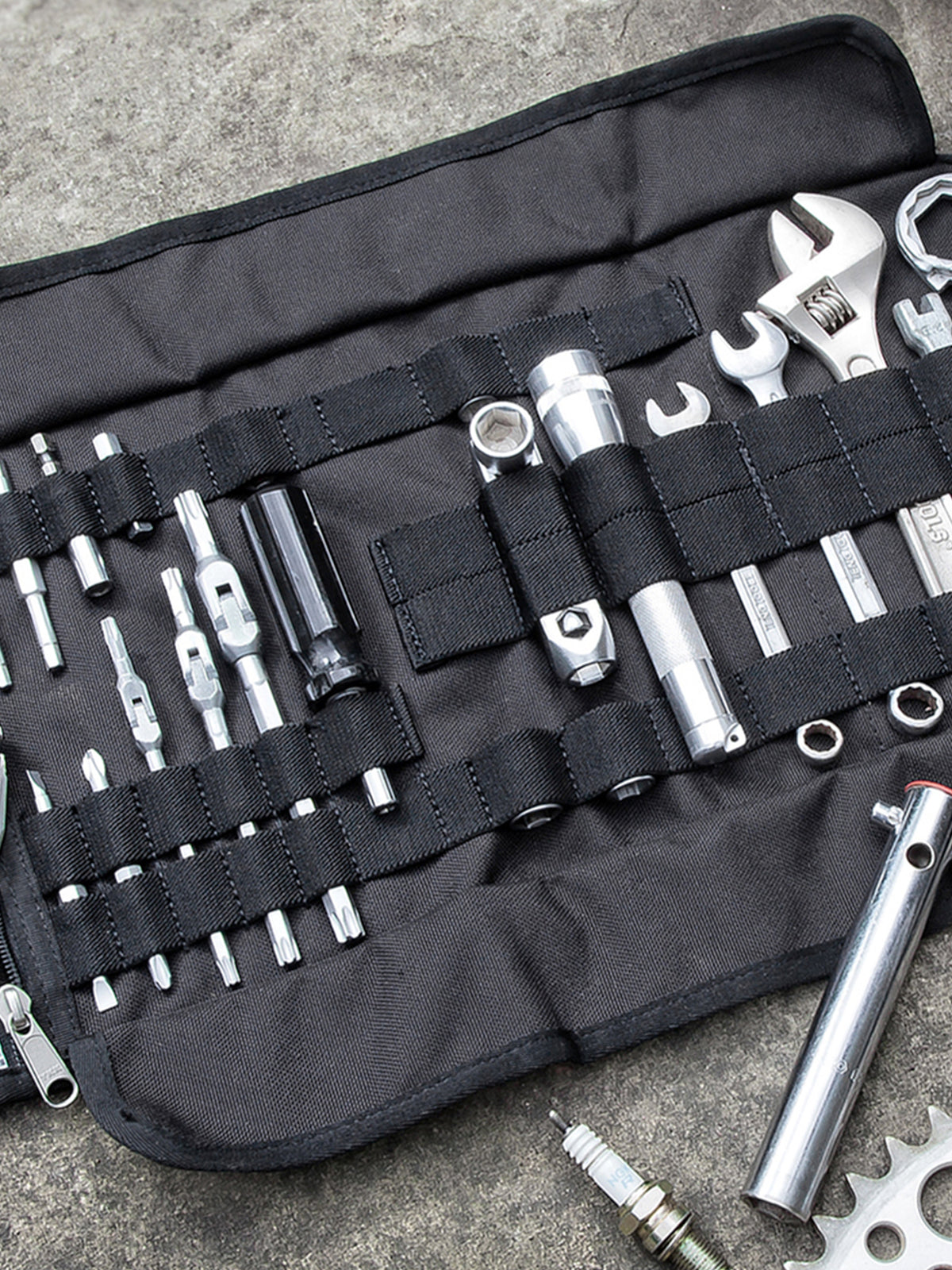 Kriega Tool Roll with tools on concrete floor